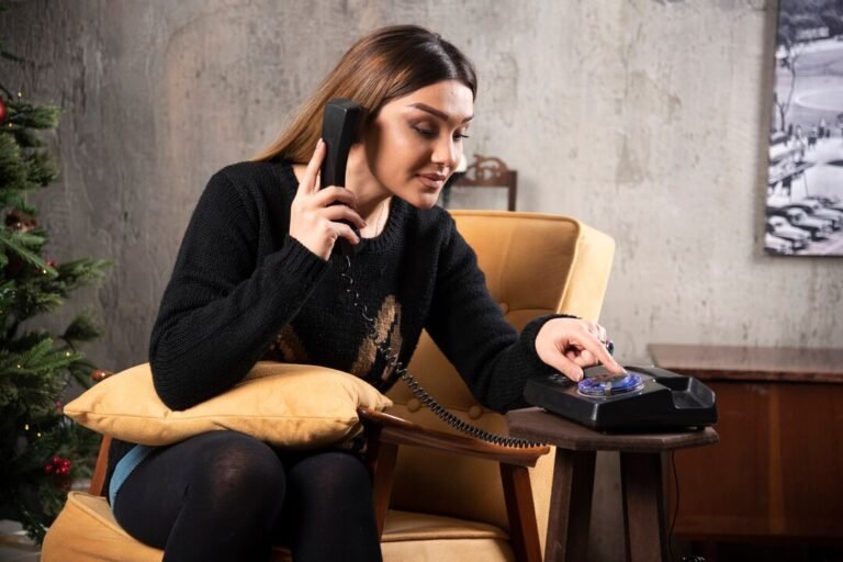 young-woman-dialing-telephone-christmas-tree_114579-80172